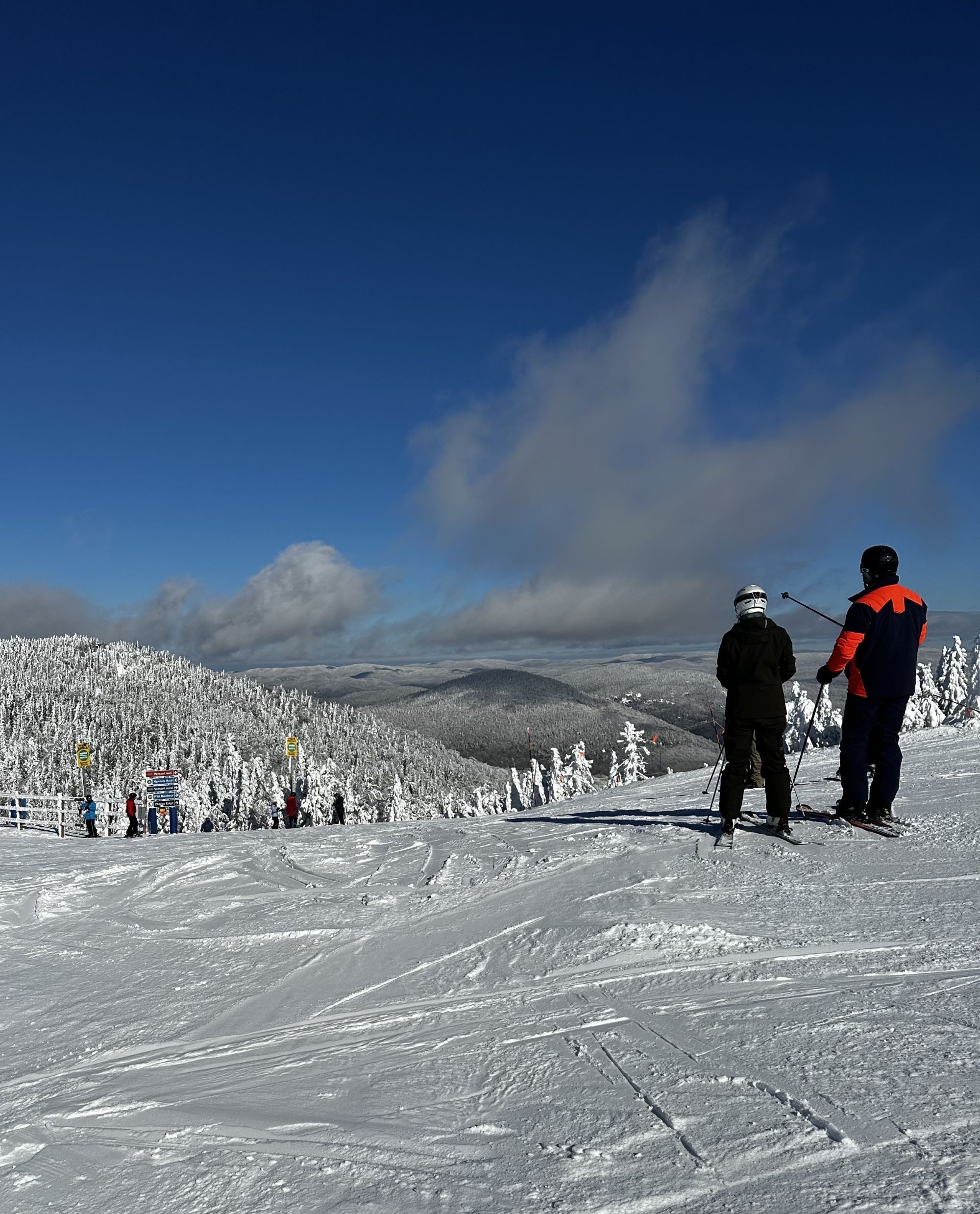 People at the top of a ski mountain.
