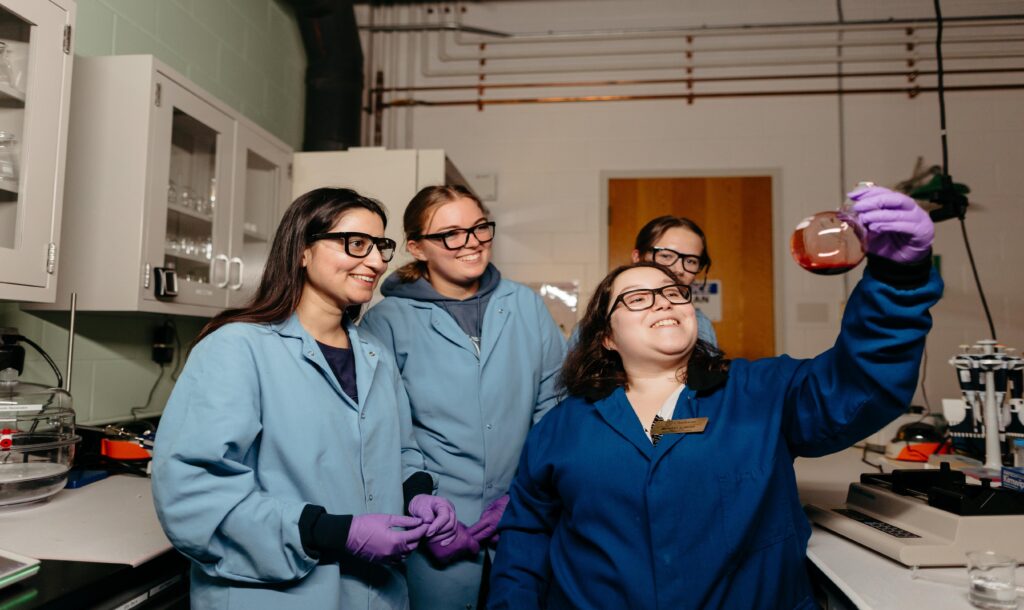 a group of students in a chemical engineering lab.