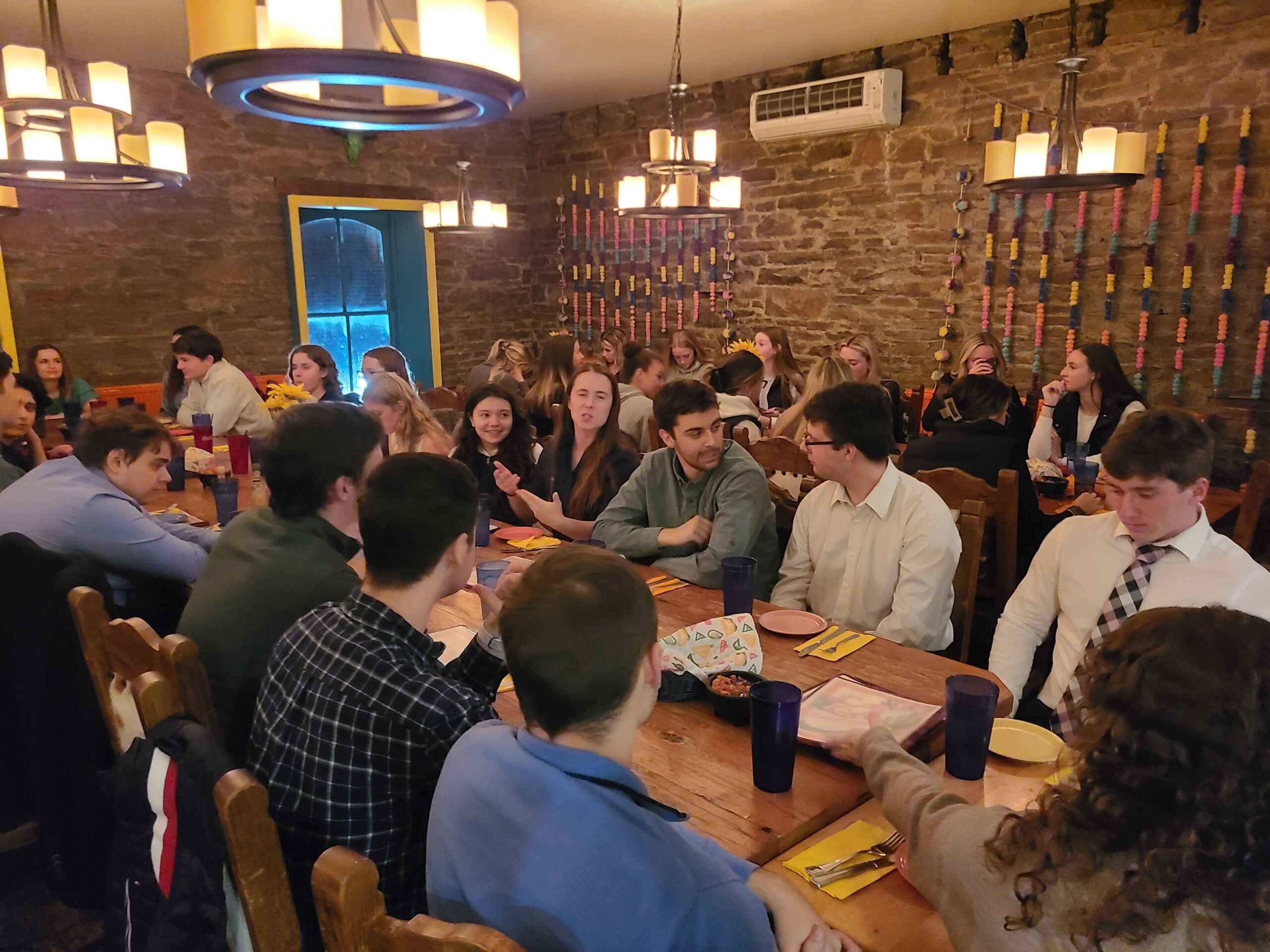 Fall 2024 Initiates enjoying dinner at the Cantina